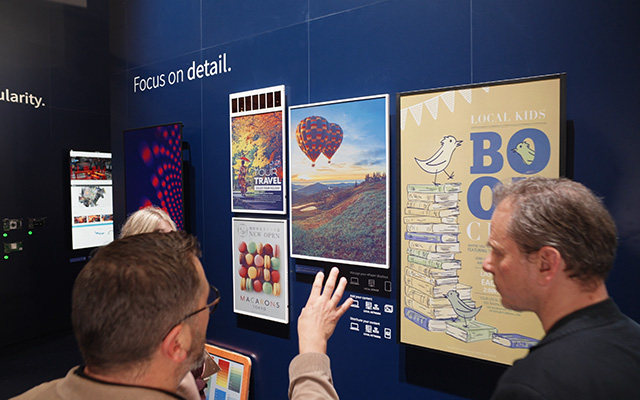 People looking at digital posters