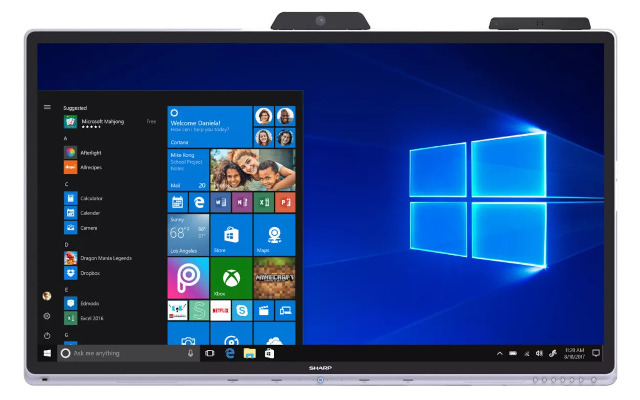 A large format display showing MS Windows on screen