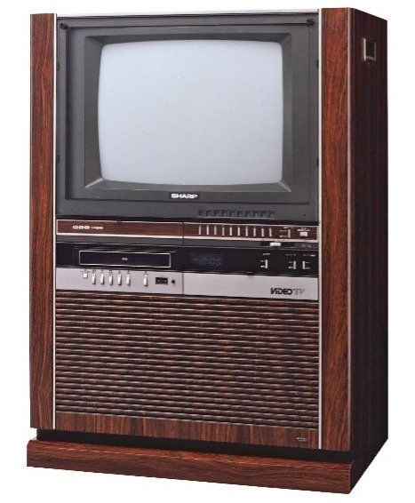 An old-style television in a floor standing cabinet
