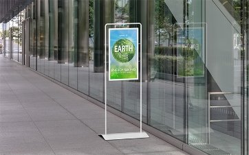 floor standing signage outside a glass fronted building